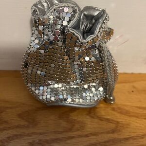 Small silver drawing string purse.